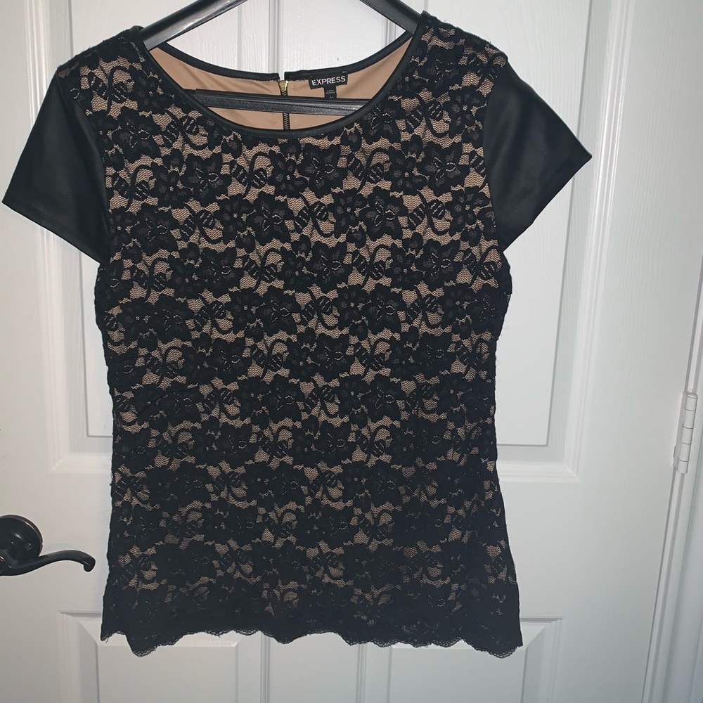 Lace top with faux leather cap sleeve.